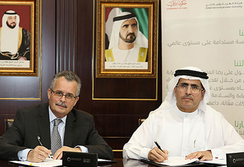 Carlos Pone, ABB, and Mohammed Al Tayer, DEWA, sign on the dotted line Carlos Pone, ABB, and Mohammed Al Tayer, DEWA, sign on the dotted line