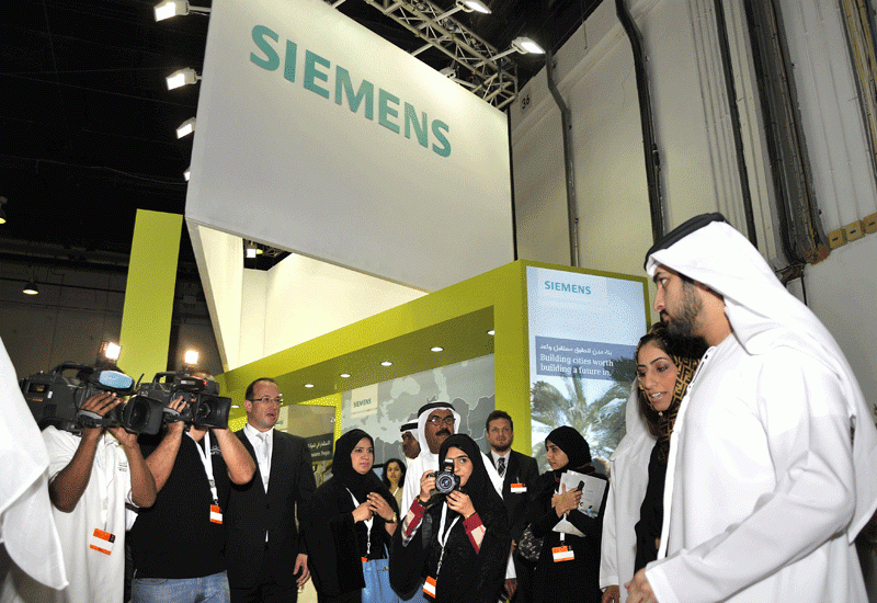 HH Sheikh Maktoum bin Mohammed bin Rashid Al Maktoum, Deputy Ruler of Dubai in front of the Siemens stand at the UAE Career Fair. HH Sheikh Maktoum bin Mohammed bin Rashid Al Maktoum, Deputy Ruler of Dubai in front of the Siemens stand at the UAE Career Fair.