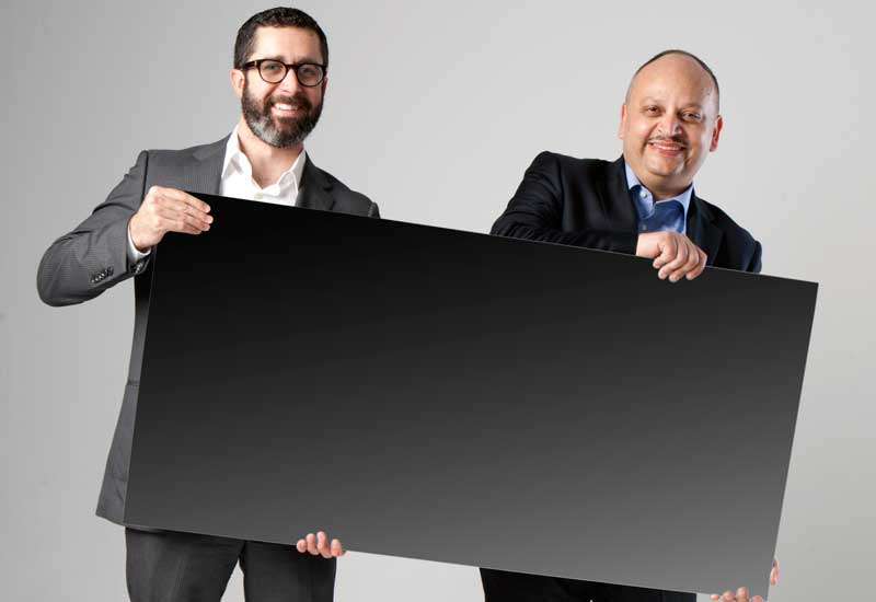 L-R: First Solar's Matt Merfert and Ahmed Nada with a Series 3 Panel. L-R: First Solar's Matt Merfert and Ahmed Nada with a Series 3 Panel.