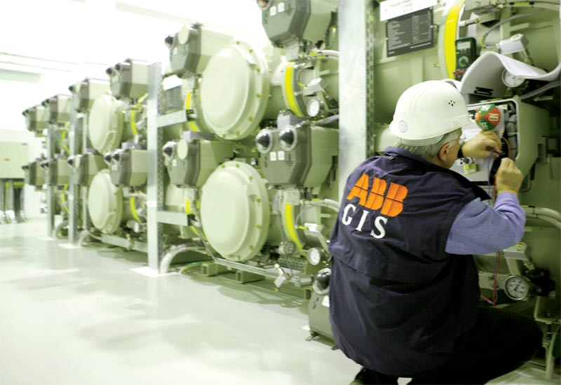 An ABB engineer conducts routine maintenance on a gas-insulated switchgear at Dubai's international airport. An ABB engineer conducts routine maintenance on a gas-insulated switchgear at Dubai's international airport.