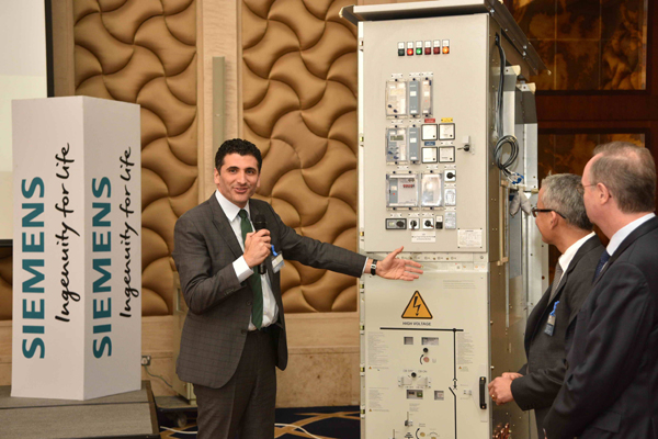 Siemens Qatar's CEO Sakiz ... showcasing the new switchgear at the launch event Siemens Qatar's CEO Sakiz ... showcasing the new switchgear at the launch event