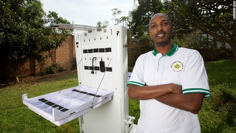 Solar energy innovator Henry Nyakarundi with his portable mobile charging Kiosk in Rwanda Solar energy innovator Henry Nyakarundi with his portable mobile charging Kiosk in Rwanda
