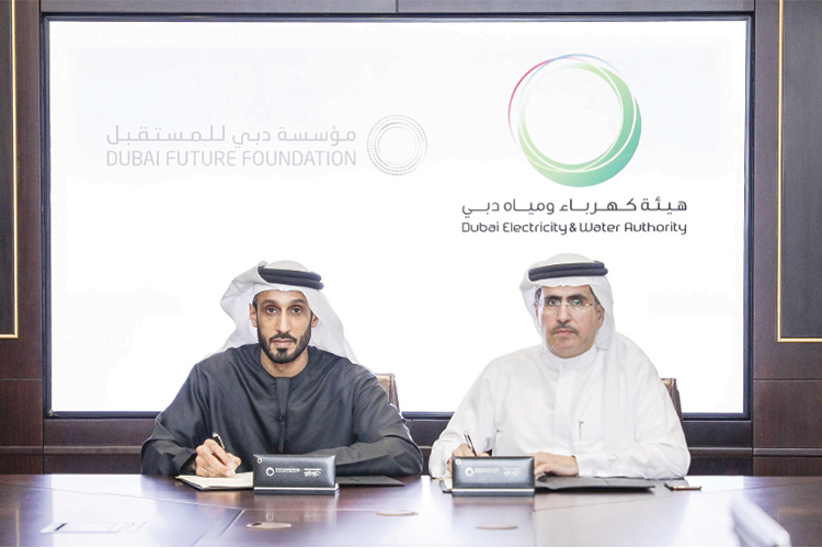 Saeed Mohammed Al Tayer, CEO and MD of DEWA (right) with Khalfan Juma Belhoul signing the MoU Saeed Mohammed Al Tayer, CEO and MD of DEWA (right) with Khalfan Juma Belhoul signing the MoU