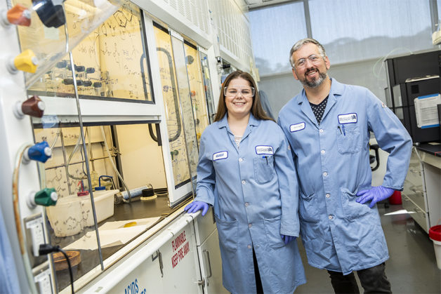 Brett Helms staff scientist right and Miranda Baran graduate student researcher of Berkeley Labs Molecular Foundry have developed AquaPIM a battery technology that could help to accelerate an electrical grid powered by renewable energyLawrence Berkeley National Laboratory Brett Helms staff scientist right and Miranda Baran graduate student researcher of Berkeley Labs Molecular Foundry have developed AquaPIM a battery technology that could help to accelerate an electrical grid powered by renewable energyLawrence Berkeley National Laboratory